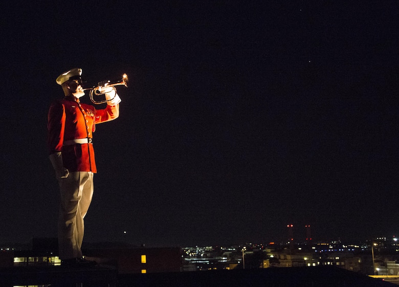 A Marine with the United States Marine Drum & Bugle Corps performs taps during the Noncommissioned Officer's Parade at Marine Barracks Washington, D.C., Aug. 19, 2016. The guest of honor for the parade was Adm. John M. Richardson, chief of Naval Operations and the hosting official was Gen. Robert B. Neller, commandant of the Marine Corps. (Official Marine Corps photo by Lance Cpl. Robert Knapp/Released)