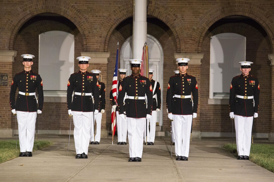 Marines from Marine Barracks Washington, D.C., perform at the Noncommissioned Officer's parade Aug. 19, 2016. The guest of honor for the parade was Adm. John M. Richardson, chief of Naval Operations, and the hosting official was Gen. Robert B. Neller, commadant of the Marine Corps. (Official Marine Corps photo by Cpl. Andrianna Daly/Released)