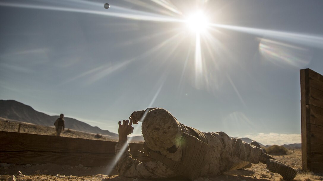 U.S. Marine Corps Lance Cpl. Siriniti Castillo, an embarker with Headquarters Battalion, 1st Marine Division, throws a simulated M67 fragmentation grenade at Marine Corps Air-Ground Combat Center Twentynine Palms, Calif., Aug. 17, 2016. Marines are required to maintain combat proficiency on all individual and crew served weapon systems.