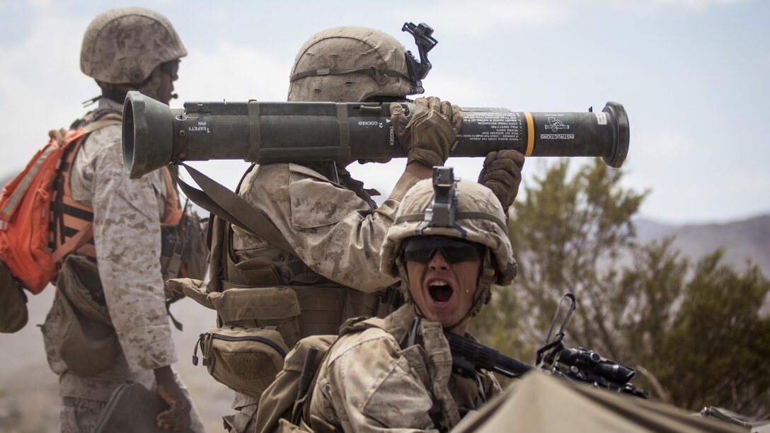 A U.S. Marine with Echo Company, 2nd Battalion, 5th Marine Regiment relays commands during Integrated Training Exercise at Marine Corps Air-Ground Combat Center Twentynine Palms, Calif., Aug. 18, 2016. ITX is designed to bring together the ground, air, and logistics combat elements of the Marine Corps into one fully capable and lethal unit, ready to respond to global uncertainty.