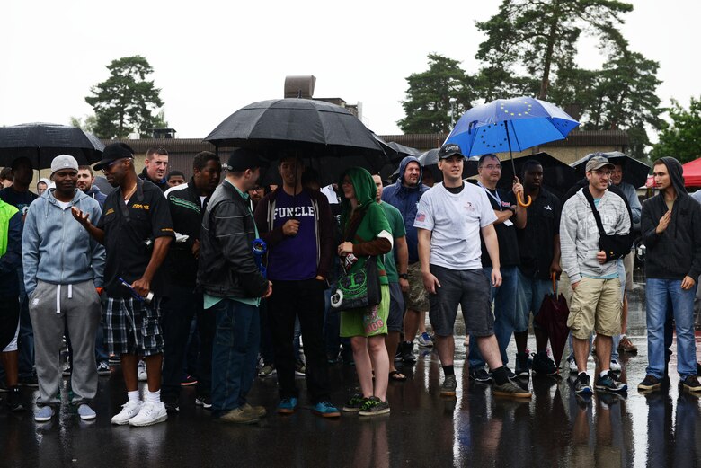 Spectators and participants listen to the announcement of the winners at the 10th annual 86th Vehicle Readiness Squadron Auto Show Aug. 20, 2016, at Ramstein Air Base, Germany. The event was open to Department of Defense members and vehicle owners from around Europe. (U.S. Air Force photo/ Airman 1st Class Joshua Magbanua)