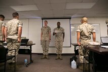 Lance Cpl. Mitchell Truex, left, and Lance Cpl. Nathaniel Slaney recite the Noncommissioned Officer's Creed in front of the students of Corporal's Course 3-16, aboard Camp Allen, Va., Aug. 18, 2016. Truex and Slaney were selected by their units to attend the U.S.  Marine Corps Forces Command Corporal’s Course 3-16 to develop leadership skills and responsibilities of NCOs. (Official U.S. Marine Corps photo by Sgt. Calvin Shamoon/ Released)