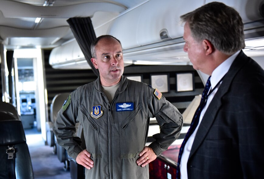 Lt. Col. Dave "Santa" Santarelli, director of operations, 73rd Airlift Squadron speaks with a local civic leader aboard a C-40C during the Belle-Scott event Aug. 18, 2016 at the 126th Air Refueling Wing hangar, Scott Air Force Base, Illinois. Local community civic leaders had the opportunity to tour a C-40C distinguished visitor aircraft and KC-135 air refueling tanker.  The Belle-Scott Committee is comprised of local community leaders who meet with Scott Air Force Base officials on a recurring basis. (U.S. Air Force photo by Christopher Parr)