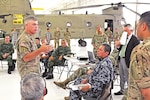 Maj. Gen. Wayne W. Grigsby Jr., commanding general of the 1st Infantry Division and Fort Riley, provides an overview of 1st Combat Aviation Brigade, 1st Inf. Div., capabilities to the Fifth Army Inter-American Relations Program delegation July 21 at Fort Riley. “FIARP is an annual Headquarters, Department of the Army-funded weeklong program established after World War II. The goal of the program is to enhance Army-to-army relations, increase interoperability and exchange ideas.