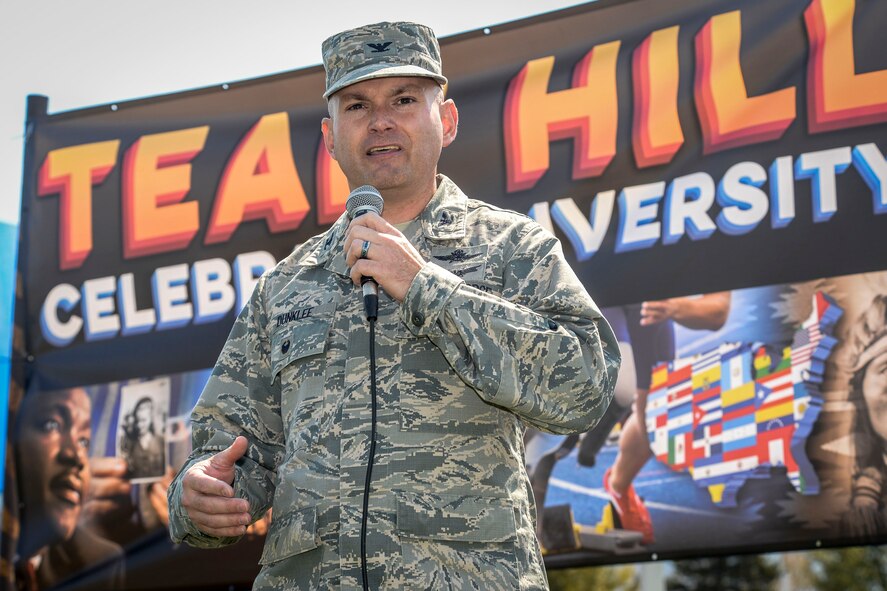 Col. David Dunklee, 75th Air Base Wing vice commander, makes opening remarks Aug. 20 during the Team Hill Diversity Festival in Centennial Park. Festival attendees received passports to be stamped while visiting booths providing information on the 10 special observances the base recognizes each year. (U.S. Air Force photo by Paul Holcomb)