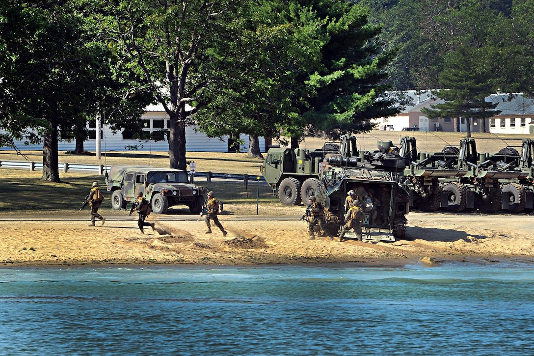 Marines disembark from an amphibious vehicle during assault training on Lake Margrethe during Exercise Northern Strike 16 at Camp Grayling, Mich., Aug. 11, 2016. Michigan Army National Guard photo by Sgt. 1st Class Helen Miller