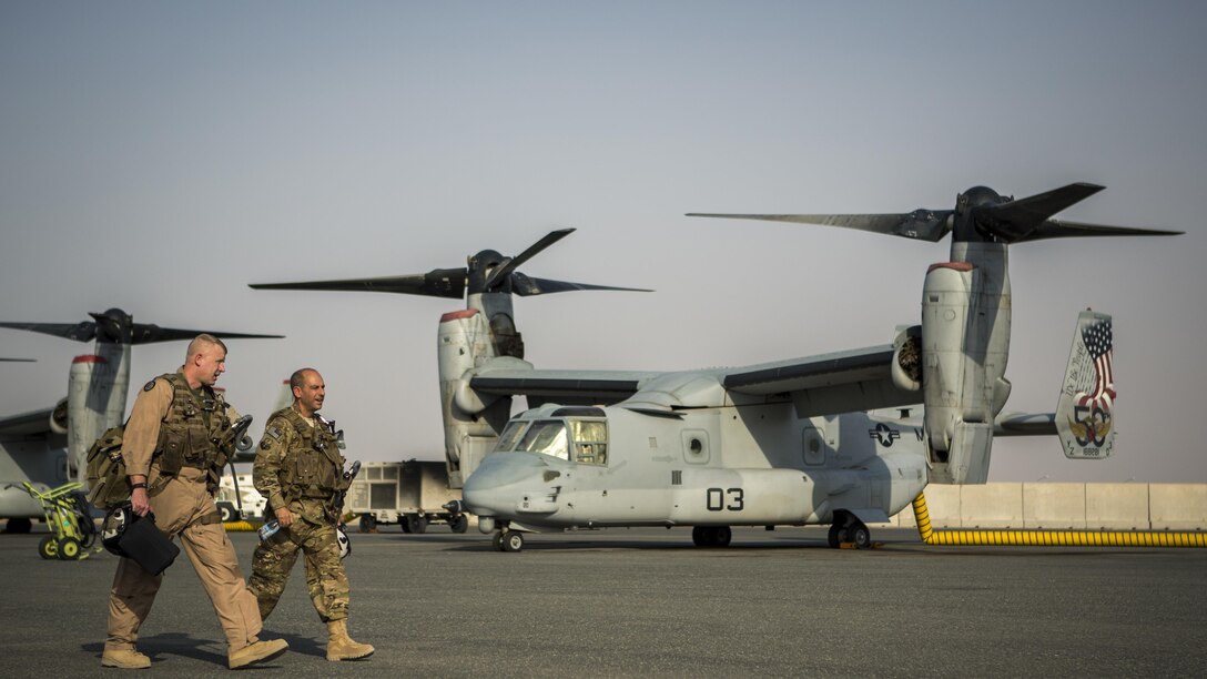U.S. Air Force Lt. Gen. Jeffrey L. Harrigian, commander of U.S. Air Forces Central Command and Combined Forces Air Component, U.S. Central Command, tours the flight line of MV-22 Ospreys with U.S. Marine Maj. Eric Keith, executive officer for Marine Medium Tiltrotor Squadron 363, Special Purpose Marine Air-Ground Task Force – Crisis Response – Central Command during a recent tour of the area of operations. USAFCENT and the CFACC oversees the development of contingency plans, conduct of air operations, and provides guidance for the coalition air campaign spanning 20 nations.