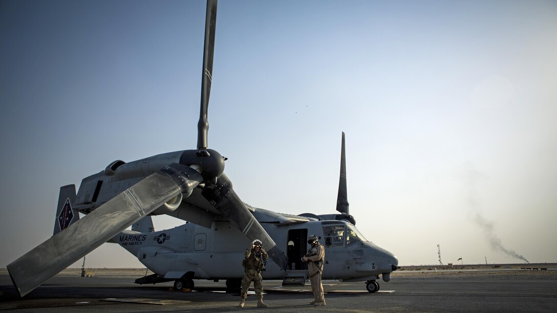 U.S. Air Force Lt. Gen. Jeffrey L. Harrigian, commander of U.S. Air Forces Central Command and Combined Forces Air Component, U.S. Central Command, prepares to pilot an MV-22 Osprey with U.S. Marine Maj. Eric Keith, executive officer for Marine Medium Tiltrotor Squadron 363, Special Purpose Marine Air-Ground Task Force – Crisis Response – Central Command during a recent tour of the area of operations. USAFCENT and the CFACC oversees the development of contingency plans, conduct of air operations, and provides guidance for the coalition air campaign spanning 20 nations.