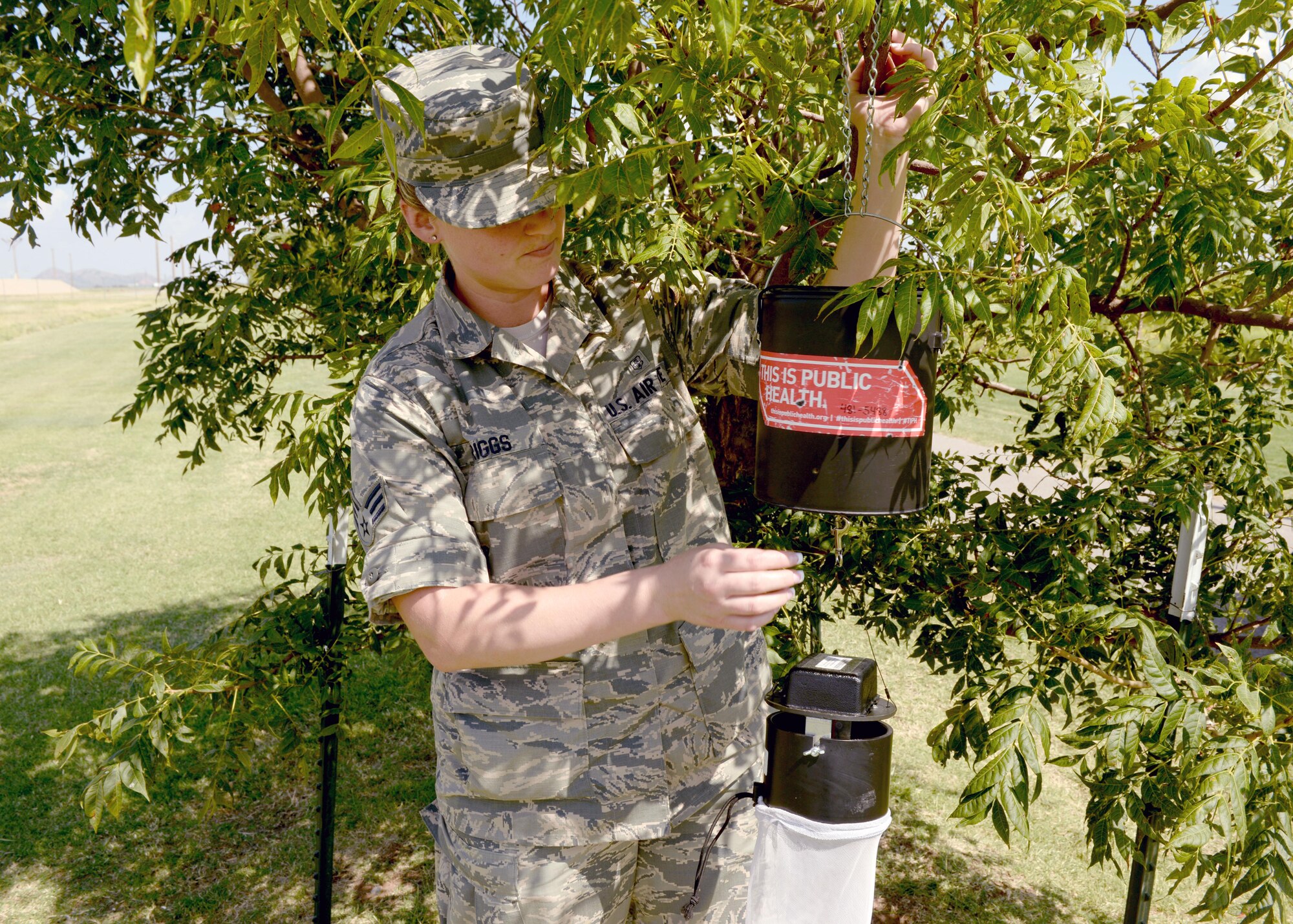 U.S. Air Force Senior Airman Brandi Spriggs, 97th Medical Operations Squadron health technician, sets up a dry ice trap to catch mosquitoes, Aug. 11, 2016, at Altus Air Force Base, Okla. The Altus AFB Public Health Office is actively testing mosquitoes for viruses and conducting surveillance on mosquito populated areas. (U.S. Air Force photo by Airman 1st Class Cody Dowell/Released) 