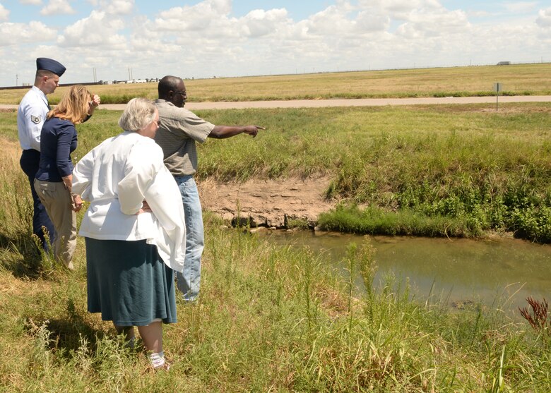 Lawrence Robinson, 97th Civil Engineer Squadron pest management foreman, shows Jackson County Health Department representatives the areas that larvicide is sprayed on Altus Air Force Base, Okla., Aug. 17, 2016. The Altus AFB Public Health Office is actively testing mosquitoes for viruses and conducting surveillance on mosquito populated areas. (U.S. Air Force photo by Airman 1st Class Cody Dowell/Released)