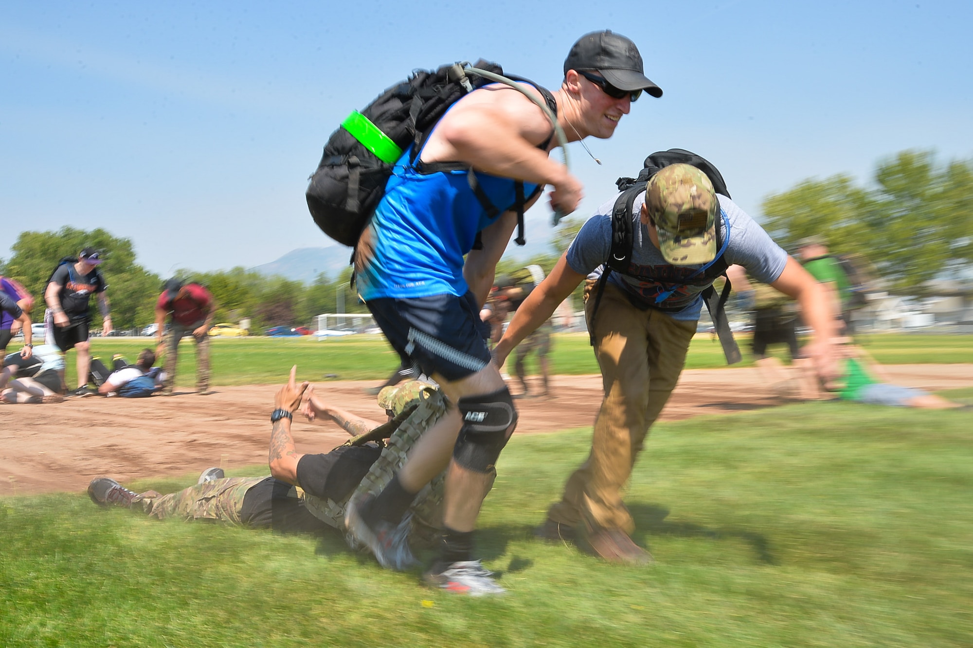 GoRuck participants transport a simulated casualty during a team cohesion challenge at Hill Air Force Base, Utah, Aug. 19, 2016.  (U.S. Air Force photo by R. Nial Bradshaw)