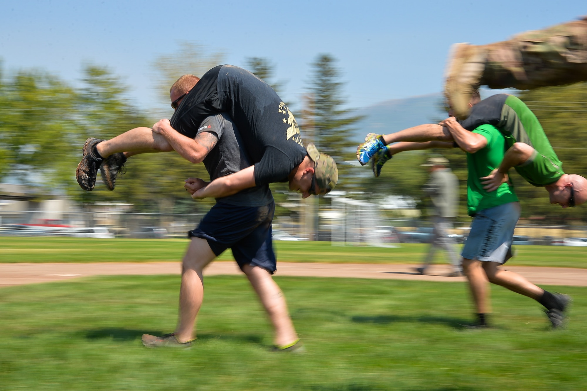 GoRuck participants transport simulated casualties during a team cohesion challenge at Hill Air Force Base, Utah, Aug. 19, 2016.  (U.S. Air Force photo by R. Nial Bradshaw)