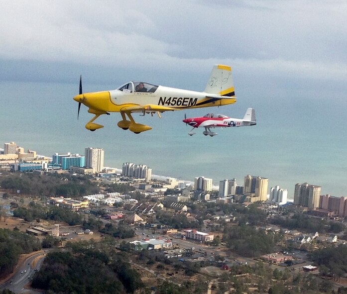 William Miller (left), 4th Training Squadron F-15E Strike Eagle instructor, flies his RV-7 along with another member of the Flying Club, February 27, 2015, near Myrtle Beach, South Carolina. The club currently has more than 50 members in the club, from Airmen to retirees, with eight people who own aircraft and fly out of Goldsboro, North Carolina, on various excursions about once a quarter. (Courtesy photo)   
