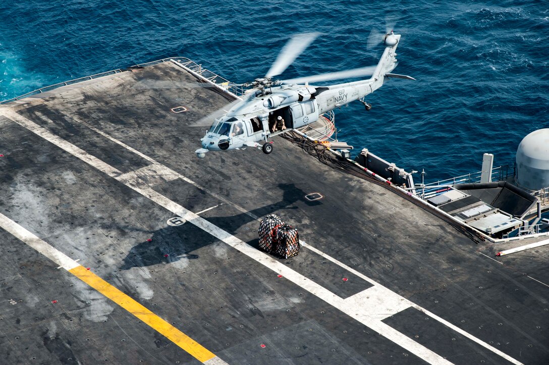 160729-N-QI061-048

ARABIAN GULF (July 29, 2016) - An MH-60S Seahawk helicopter assigned to the Dusty Dogs of Helicopter Sea Combat Squadron (HSC) 7 delivers supplies to the flight deck of the aircraft carrier USS Dwight D. Eisenhower (CVN 69) (Ike) during a replenishment-at-sea with the fast-combat support ship USNS Arctic (T-AOE 8). Ike and its Carrier Strike Group are deployed in support of Operation Inherent Resolve, maritime security operations and theater security cooperation efforts in the U.S. 5th Fleet area of operations. (U.S. Navy photo by Mass Communication Specialist Third Class Nathan T. Beard/Released)