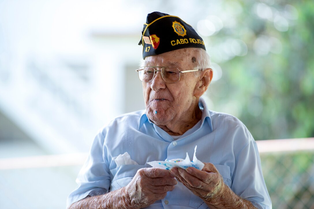 World War II veteran Army Sgt. 1st Class Santiago Pabon celebrates his 95th birthday with cake at the American Legion Hall in Cabo Rojo, Puerto Rico, Aug. 10, 2016. DoD photo by EJ Hersom
