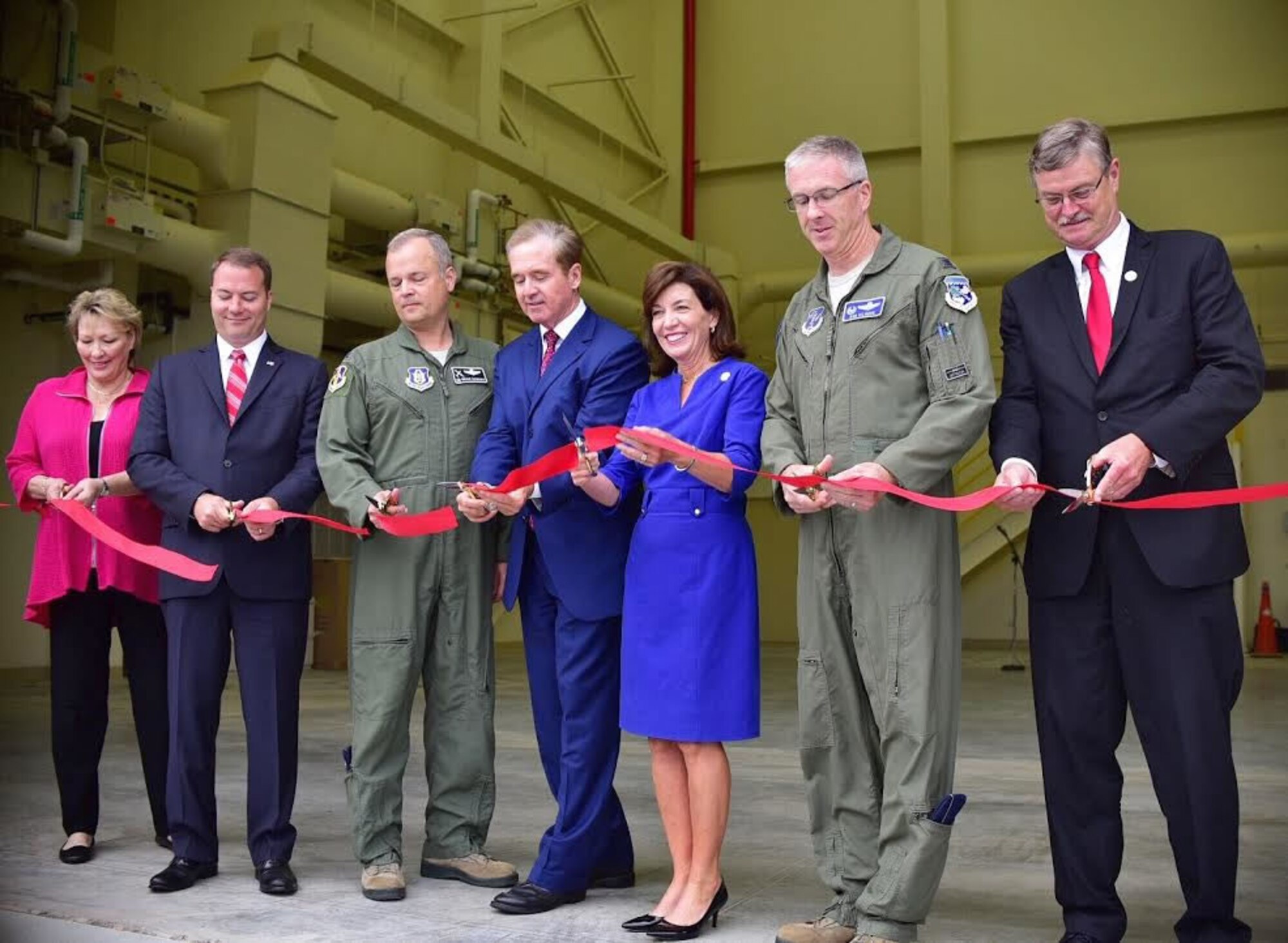 Col. Brian Bowman, 914th Airlift Wing Commander (3rd from left) is joined by Col. Robert Kilgore, 107th Attack Wing Commander and other elected officials to perform a ribbon cutting ceremony at the Niagara Falls Air Reserve Station on Aug. 16, 2016. The ceremony took place to welcome the new flight simulator building on base. (U.S. Air Force photo by Staff Sgt. Richard Mekkri.)  