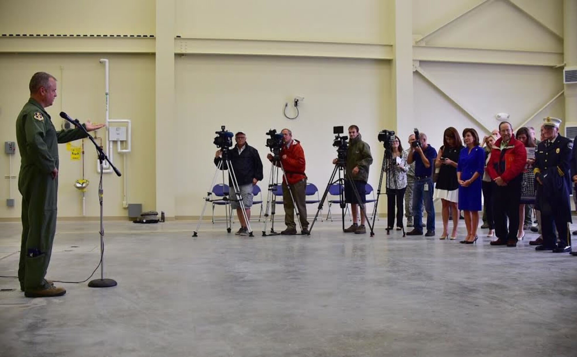 Col. Brian Bowman, commander, 914th Airlift Wing addresses the media and guests at the Niagara Falls Air Reserve Station on Aug. 16, 2016. Bowman and the Wing hosted the event to welcome the new flight simulator building to the base. (U.S. Air Force photo by Staff Sgt. Richard Mekkri) 