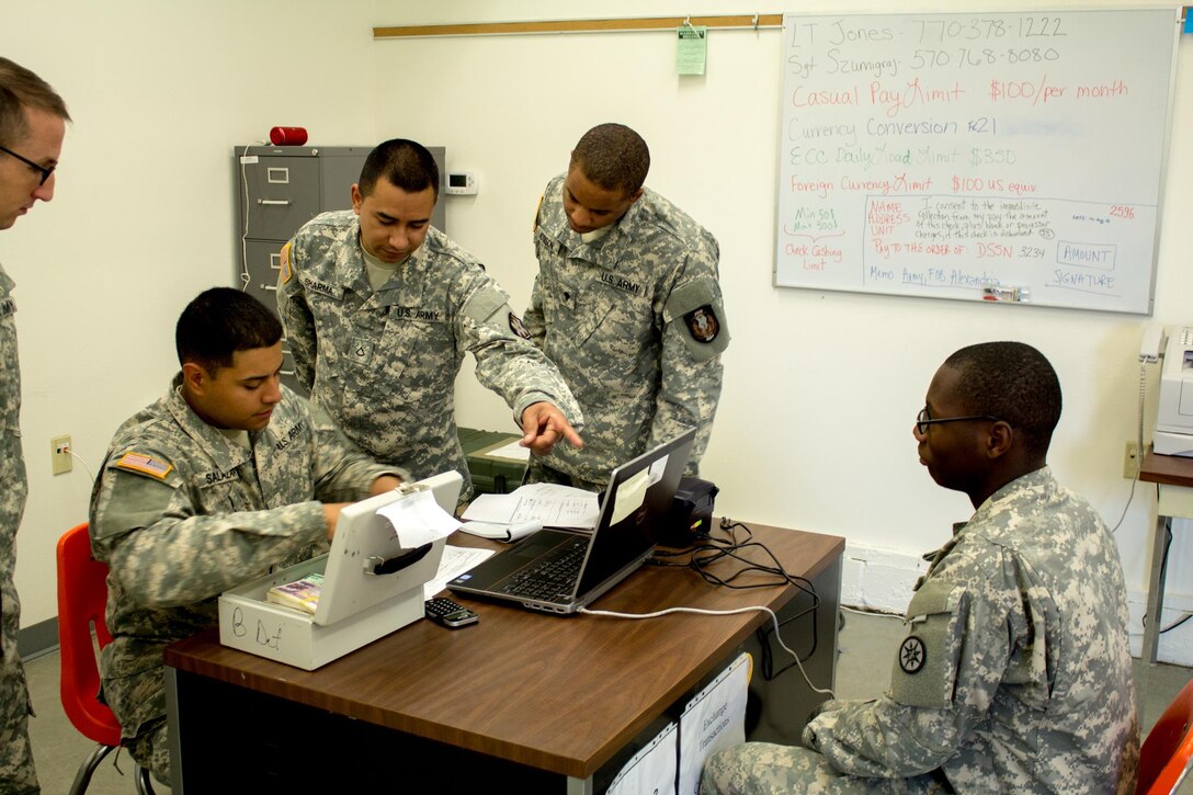 FORT MCCOY, Wis. –U.S. Army Reserve Soldiers conduct cashier training during Exercise Diamond Saber August 2016 at Fort McCoy, Wis. with Spc. Dandi Addison (center) of the Texas National Guard 49th Financial Management Support Unit, and Pfc. Jordan West (right) of the 254th Quartermaster Company. Diamond Saber is a joint exercise that brings together finance units from the National Guard, Army Reserve and Active Army to simulate how they would work while on deployment. (U.S. Army Reserve Photo by Sgt. Clinton Massey, 206th Broadcast Operations Detachment)
