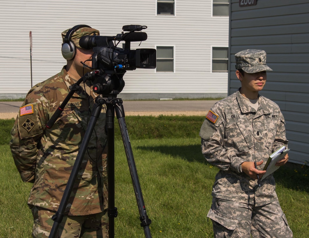FORT MCCOY, Wis. - U.S. Army Reserve Soldiers Spc. Trace Lundberg (left) of the 206th Broadcast Operations Detachment from Grand Prairie, Texas, and 1st Lt. Angelina Cillo of the 366th Mobile Public Affairs Detachment from Wichita, Kan., conduct an interview for Exercise News Day August 2016. Multiple public affairs units combine resources to give U.S. Army Reserve units media coverage during their Annual Training exercises. (U.S. Army Reserve Photo by Sgt. Clinton Massey, 206th Broadcast Operations Detachment)