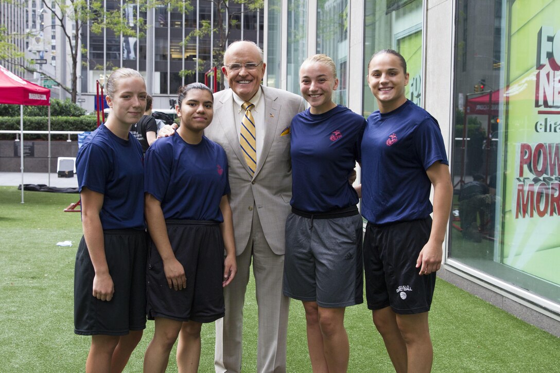 U.S. Marine Corps enlistees Emily Warren, Carlota Rolden, Dylan Kowalski and Maria Daume pose for a photo with Rudy Giuliani, former mayor of New York City, outside of the Fox News building in New York City, Aug. 17, 2016. The Marines visited Fox & Friends, a popular morning show, to demonstrate their commitment to female Marines and to the integration of women into combat military occupational specialties.