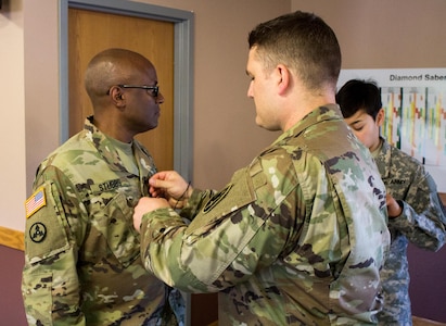 FORT MCCOY, Wis. – Lt. Col. Fredrick Stubbs, the Deputy Director of 469th Financial Management Support Center, is prepared for an interview about the objectives of Exercise Diamond Saber by U.S. Army Reserve Soldiers Spc. Trace Lundberg, (center), of the 206th Broadcast Operations Detachment from Grand Prairie, Texas, and 1st Lt. Angelina Cillo, (right), of the 366th Mobile Public Affairs Detachment from Wichita, Kan. Exercise News Day August 2016 is tasked to provide public affairs support during exercises, like Exercise Diamond Saber, throughout the U.S. Army Reserve. (U.S. Army Reserve photo by Sgt. Clinton Massey, 206th Broadcast Operations Detachment)