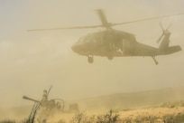 Flight crews from the 8-229th Assault Helicopter Battalion conduct sling load operations with elements from the 1-163 Field Artillery Regiment of the Indiana National Guard. (Photo by Renee Rhodes / Fort Knox Visual Information).