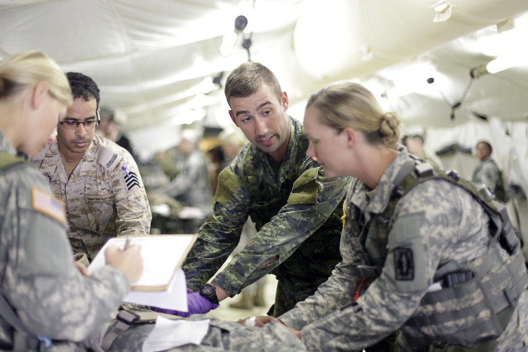 U.S. Army Reserve Soldiers train with multi-national forces for Combat Casualty Care at Forward Operating Base Justice on Fort McCoy, Wis. on August 18, 2016. Nearly 7,000 service members from across the country are participating in the 86th Training Division's Combat Support Training Exercise at Fort McCoy, Wis. More than 100 units from across the Army, the Air Force, the Navy, the Marines, and the Canadian Army are training at the 84th Training Command's final exercise of 2016. (U.S. Army Photo by Sgt. Tierney P. Curry/Released)