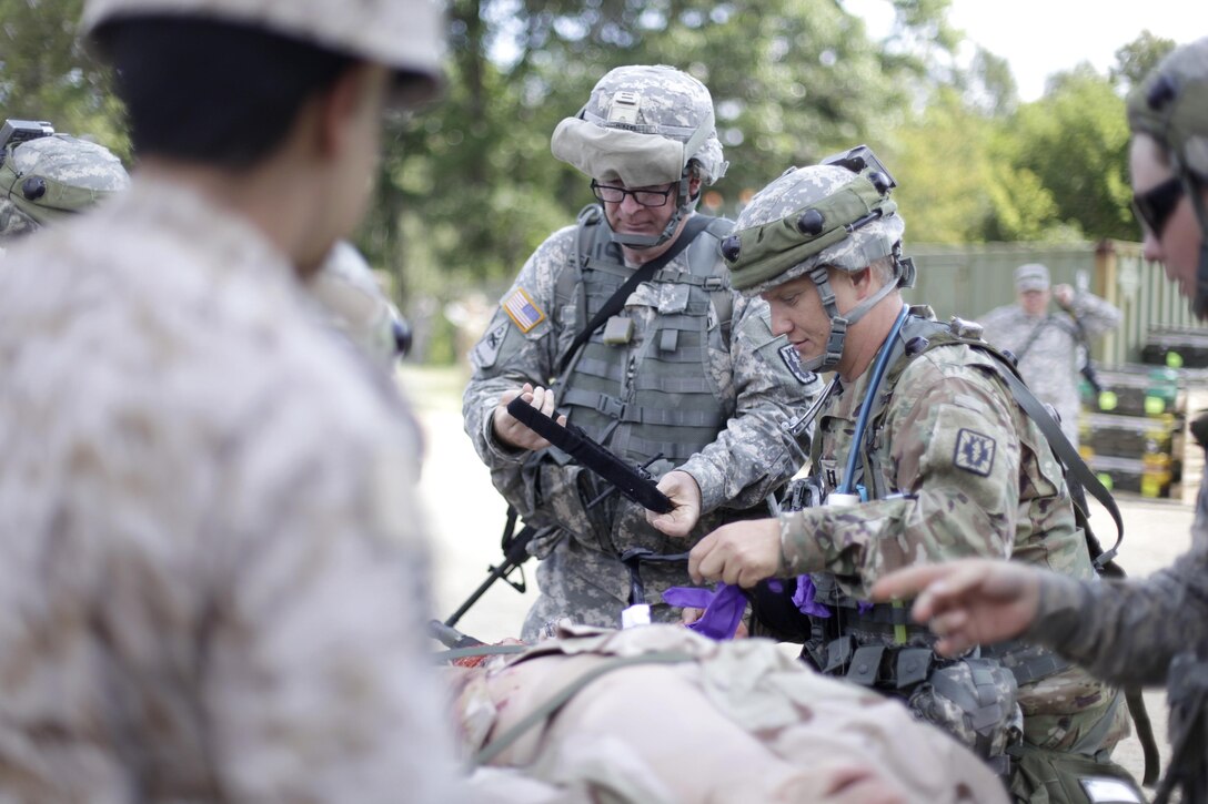 U.S. Army Reservists train with multi-national forces performing Combat Casualty Care at Forward Operating Base Justice on Fort McCoy, Wis. on August 18, 2016. Nearly 7,000 service members from across the country are participating in the 86th Training Division's Combat Support Training Exercise at Fort McCoy, Wis. More than 100 units from across the Army, the Air Force, the Navy, the Marines, and the Canadian Army are training at the 84th Training Command's final exercise of 2016. (U.S. Army Photo by Sgt. Tierney P. Curry/Released)