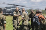 Lt. Gen. Michael Dana, center-left, Deputy Commandant of Installations and Logistics, shakes hands with Col. Mathew Reuter, center, commanding officer of Combat Logistics Regiment 25, at Camp Lejeune, N.C., Aug. 17. Dana visited various units throughout II Marine Expeditionary Force to observe advancements in logistical technology. (U.S. Marine Corps photo by Sgt. Lucas Hopkins)