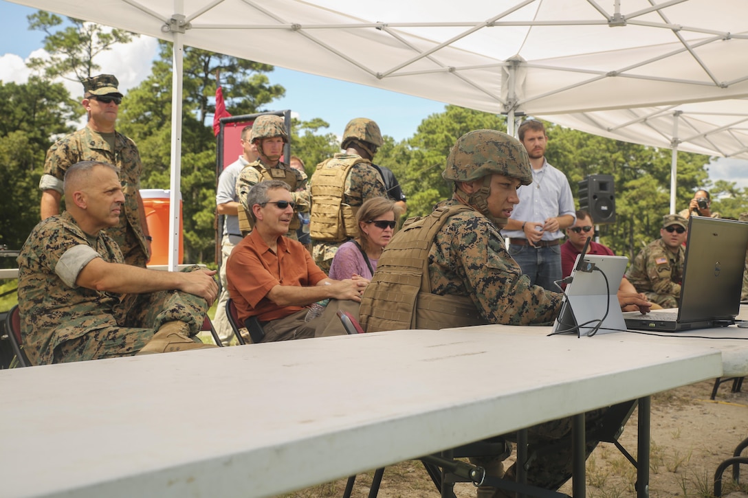 Lt. Gen. Michael Dana, left, Deputy Commandant of Installations and Logistics, Alan Estevez, center, the Principal Deputy under Secretary of Defense for Acquisition, Technology and Logistics, and Kristin French, center-right, the Principal Deputy under Secretary of Defense for Logistics and Material  readiness, view a demonstration of the Joint Tactical Aerial Resupply Vehicle at Camp Lejeune, N.C., Aug. 17. The group visited various units throughout 2nd Marine Logistics Group to get a first-hand look at logistical innovation throughout the unit. (U.S. Marine Corps photo by Sgt. Lucas Hopkins)