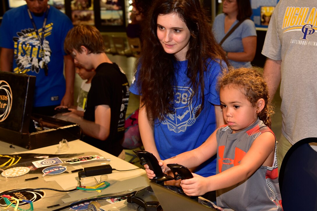 DAYTON, Ohio -- Youth participate in aerospace demonstration stations during Family Day on Aug. 20, 2016, at the National Museum of the U.S. Air Force. (U.S. Air Force photo) 
