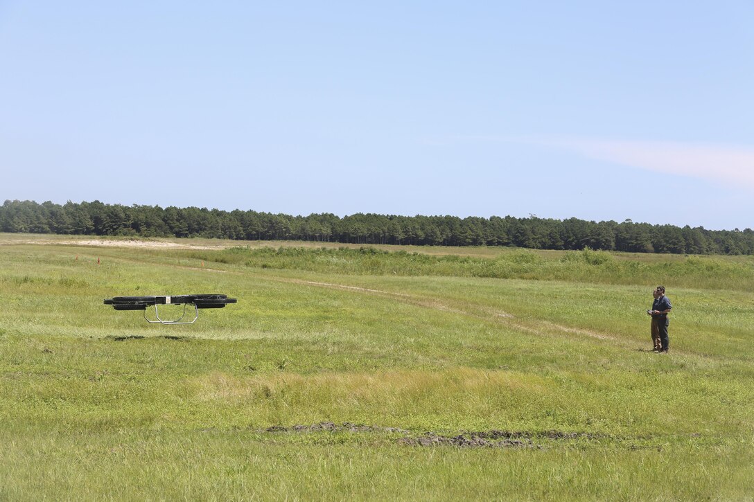 Operators fly a Joint Tactical Aerial Resupply Vehicle during a demonstration for distinguished visitors at Camp Lejeune, N.C., Aug. 17. The drone carries up to 200 pounds and can be directly integrated with infantry, tank and artillery units. Alan Estevez, Principal Deputy under Secretary of Defense for Acquisition, Technology and Logistics, Kristin French, Principal Deputy under Secretary of Defense for Logistics and Material readiness, and Lt. Gen. Michael Dana, Deputy Commandant of Installations and Logistics, visited the base to observe logistical innovation throughout II Marine Expeditionary Force. (U.S. Marine Corps photo by Sgt. Lucas Hopkins)