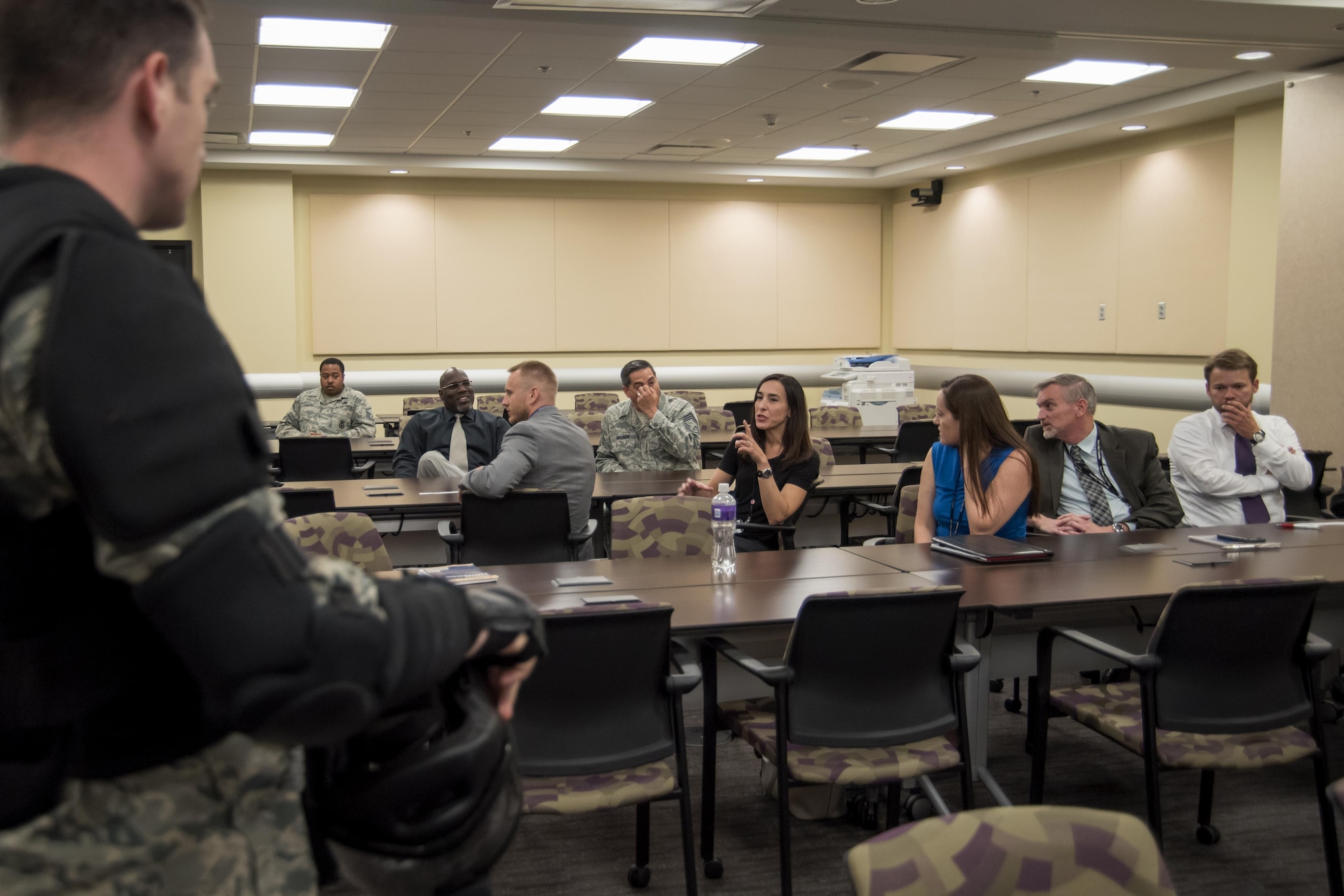 Tech. Sgt. Logan Ray, 11th Security Support Squadron assistant NCO in charge of training, listens while members of Joint Base Andrews, Md., discuss how they would react during an active shooter scenario, while attending training at the Jacob E. Smart Building on base, Aug. 17, 2016. The training, held by the 11th SSPTS, instructed attendees on how to react during an active shooter incident in specific office locations. Attendees also had the opportunity to implement the training they learned during an active shooter drill. (U.S. Air Force photo by Airman Gabrielle Spalding) 