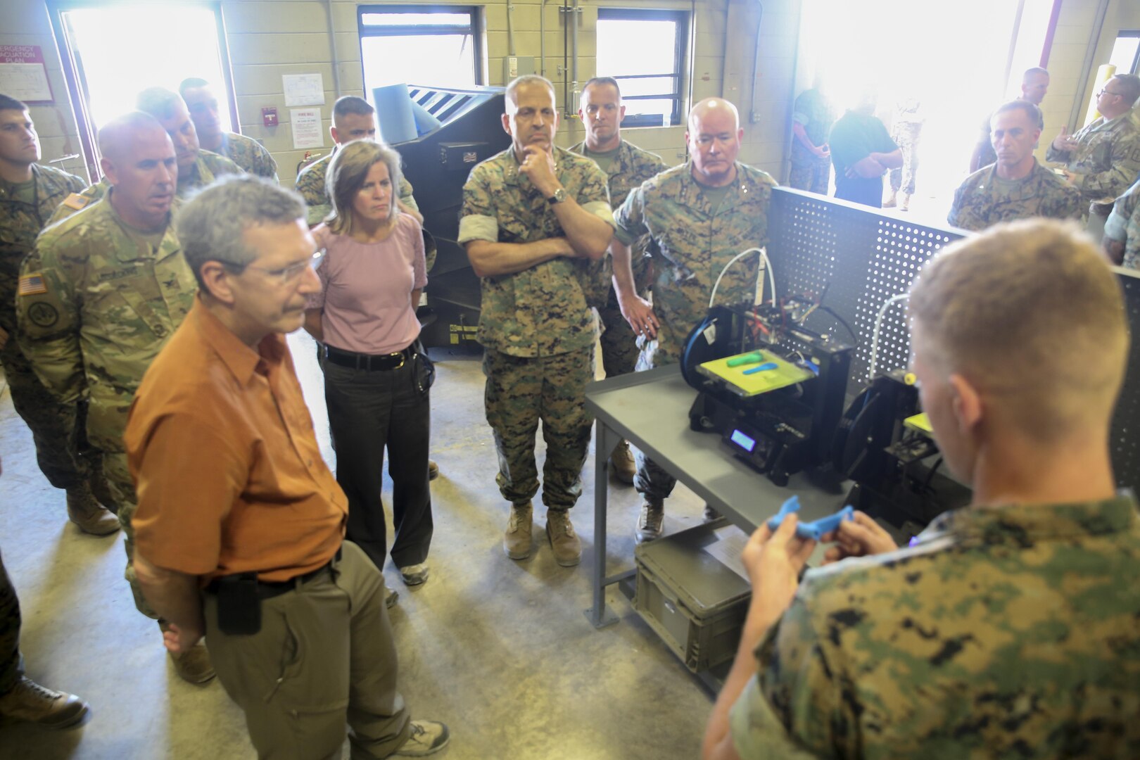 Alan Estevez, left, Principal Deputy under Secretary of Defense for Acquisition, Technology and Logistics, Kristin French, center-left, Principal Deputy under Secretary of Defense for Logistics and Material  readiness, and Lt. Gen. Michael Dana, center, Deputy Commandant of Installations and Logistics, observe a demonstration of 3D printing and additive manufacturing at Camp Lejeune, N.C., Aug. 17. Additive manufacturing can recreate small parts for vehicles and other equipment, which allows for faster reparations. The group visited several units throughout II Marine Expeditionary Force to receive a first-hand look at technological innovation helping to advance logistics operations. (U.S. Marine Corps photo by Sgt. Lucas Hopkins)