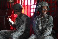 FORT MCCOY, Wis. -- Pfc. Justin Hicks and Pfc. ShaQuandra Jones, both Army Reserve Soldiers from the 824th Quartermaster Company out of Fort Bragg, N.C., receive transport in the rear cabin of the CH-47 Chinook as part of the Combat Support Training Exercise at Fort McCoy, Wis., on Aug. 17, 2016. CSTX immerses Army Reserve Soldiers and other service members in real-world training scenarios to enhance unit readiness in the planning, preparation, and execution of combat service support operations. (U.S. Army Reserve photo by Spc. Christopher A. Hernandez, 345th Public Affairs Detachment)
