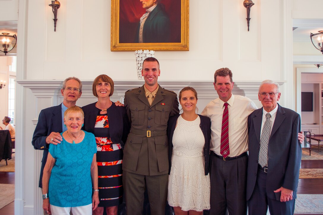 Second Lieutenant Trevor Weaser celebrates with family after his commissioning ceremony aboard Marine Corps Base Quantico, Va., August 7th, 2016. The mission of Officer Candidate School is to educate and train officer candidates in order to evaluate and screen individuals for qualities required for commissioning as a Marine Corps officer.  (Courtesy photo by 2nd Lt. Trevor Weaser)