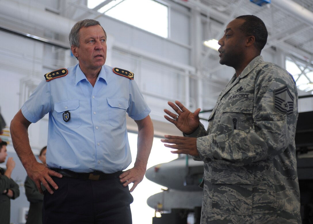 U.S. Air Force Senior Master Sgt. Kalandus Morgan, a member of the 2nd Bomb Wing, right, describes the capabilities and payload associated with the B-52 Stratofortress to German air force Lt. Gen. Joachim Wundrak, commander of German Air Operations Command, during a visit to Barksdale Air Force Base, La., Aug. 19, 2016. The German officer also had the opportunity to tour the 608th Air Operations Center located at Headquarters Eighth Air Force. (U.S. Air Force photo by A1C Stuart Bright)