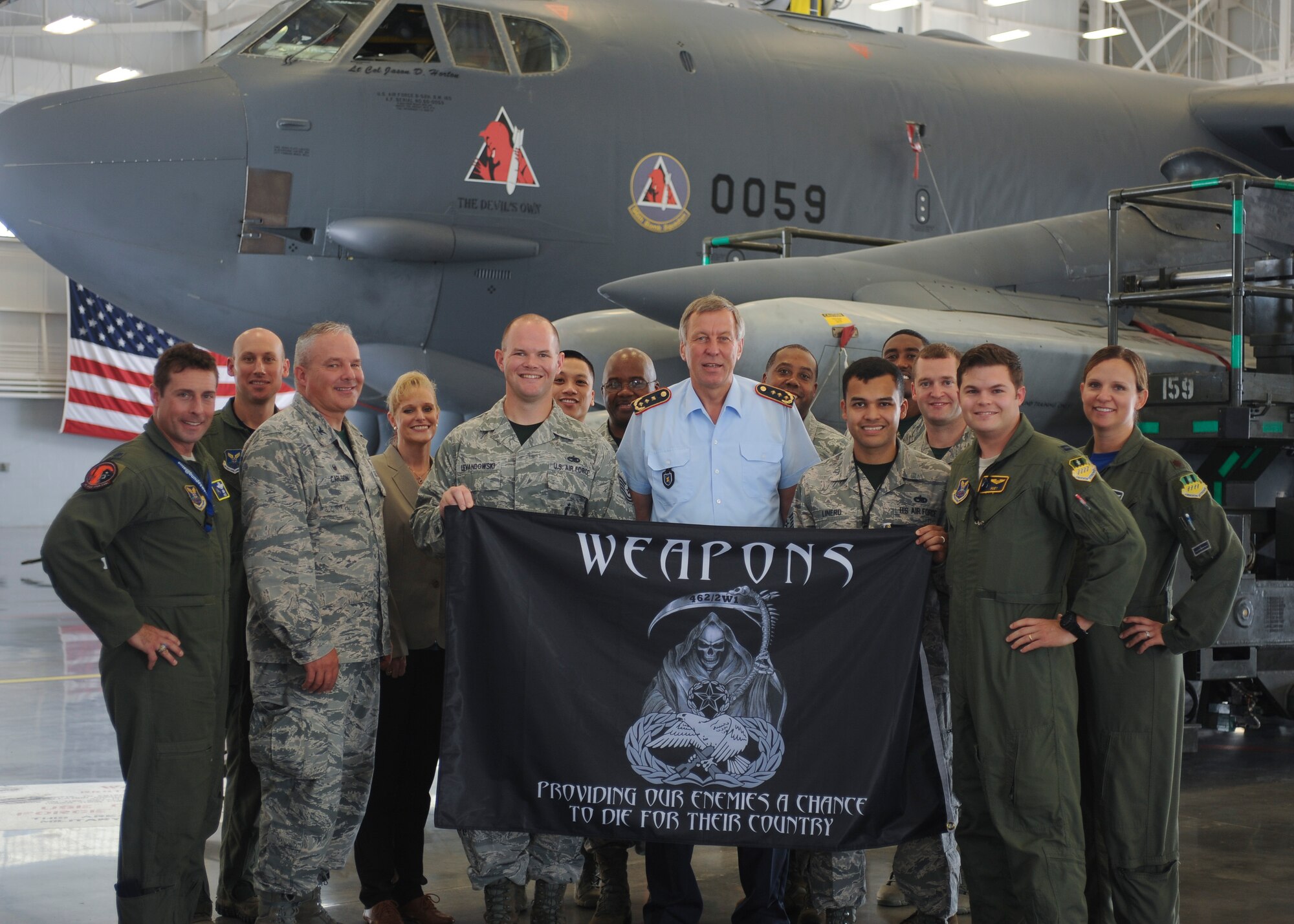 German air force Lt. Gen. Joachim Wundrak, commander of German Air Operations Command, stands front and center with Airmen from the 2nd Bomb Wing and Eighth Air Force and a B-52 Stratofortress at Barksdale Air Force Base, La., Aug. 19, 2016. Wundrak received a first-hand look at the aircraft's weapons system and load trainers as well as other "Mighty Eighth" assets. (U.S. Air Force photo by A1C Stuart Bright)