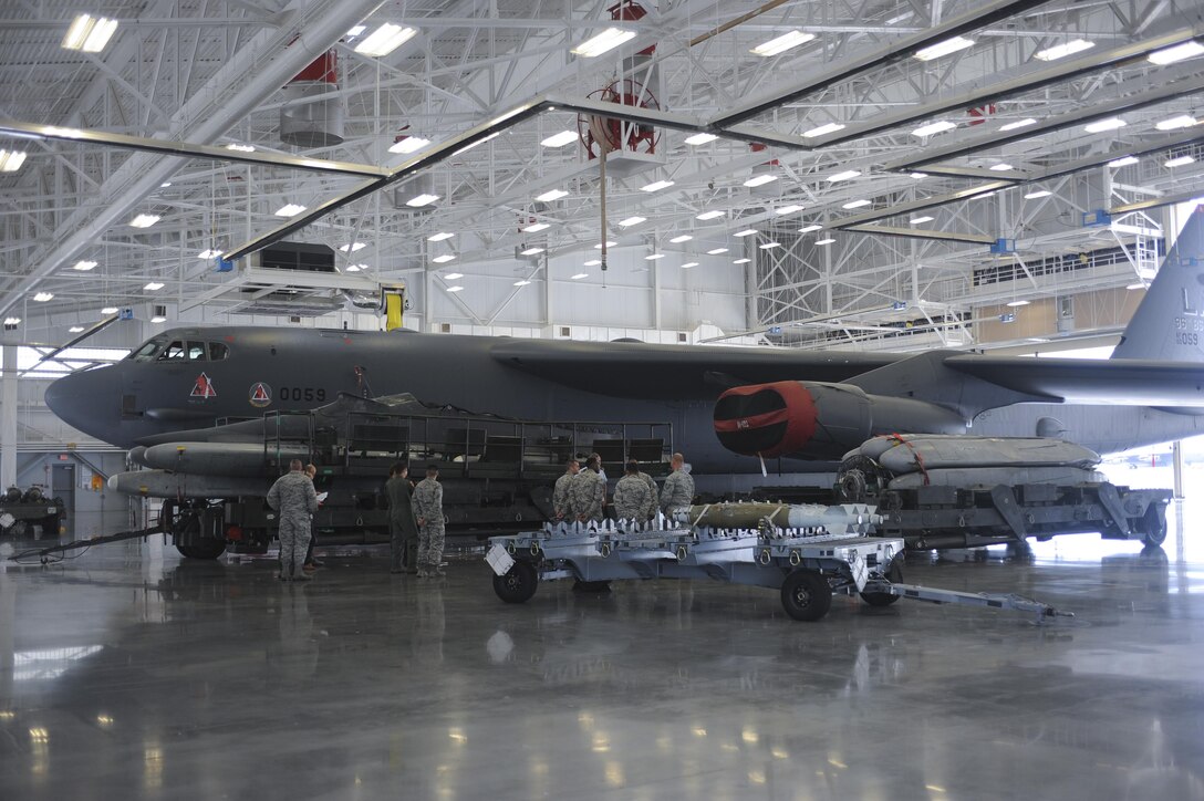 Airmen from the 2nd Bomb Wing and Eighth Air Force showcase a B-52 Stratofortress and its munitions to German air force Lt. Gen. Joachim Wundrak, commander of German Air Operations Center, during a visit to Barksdale AFB, La., Aug. 19, 2016. Wundrak also toured the 608th Air Operations Center located at Headquarters Eighth Air Force. (U.S. Air Force photo by A1C Stuart Bright)