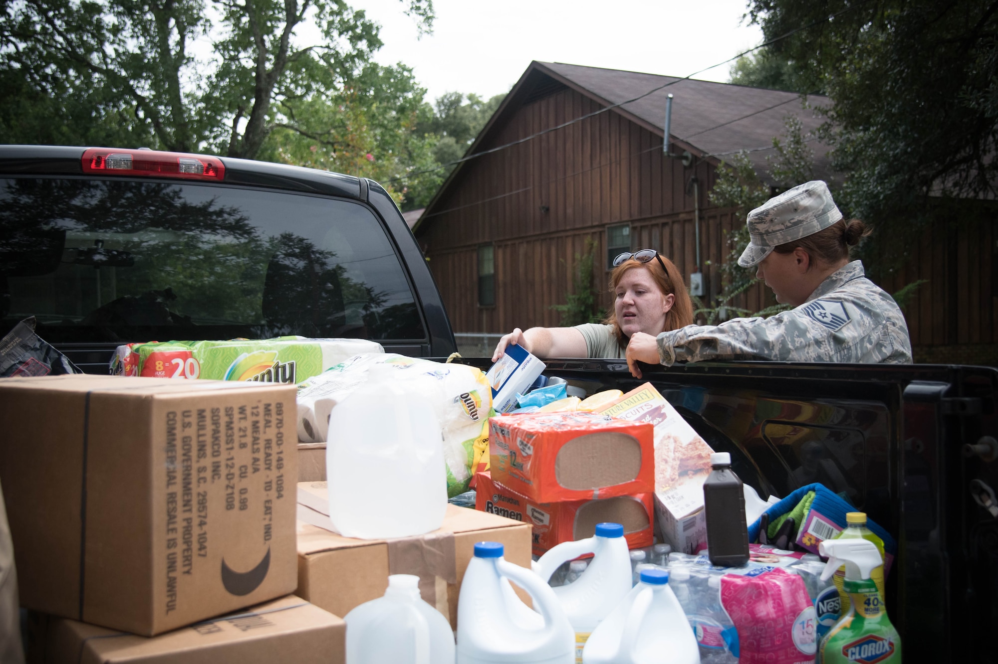 Airmen help one another with response and recovery efforts Aug. 19 after flooding in Baton Rouge, Louisiana. (U.S. Air Force photo by Senior Airman Heather Heiney)