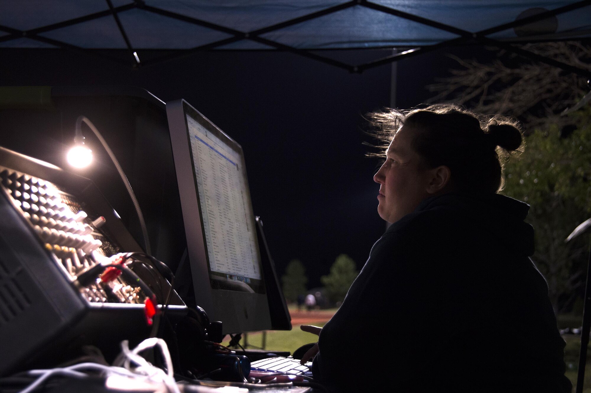 Capt. Kelcie Haner, 4th Space Operations Squadron, plays music to encourage participants in the early morning during Schriever Challenge at Schriever Air Force Base, Colorado, Friday, Aug. 19, 2016. All proceeds for the event went to the Rocky Mountain Fisher House, a “home away from home” for military families during a difficult time when a service member is at a hospital. (U.S. Air Force photo/Tech. Sgt. Julius Delos Reyes) 