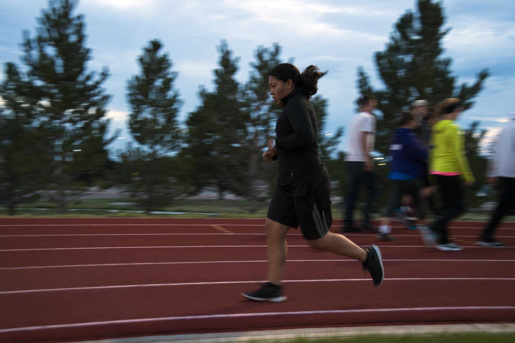 Staff Sgt. Aurora Antonio, 19th Space Operations Squadron, run on the track during Schriever Challenge at Schriever Air Force Base, Colorado, Friday, Aug. 19, 2016. The challenge raised $2,300 for the Rocky Mountain Fisher House. (U.S. Air Force photo/Tech. Sgt. Julius Delos Reyes)