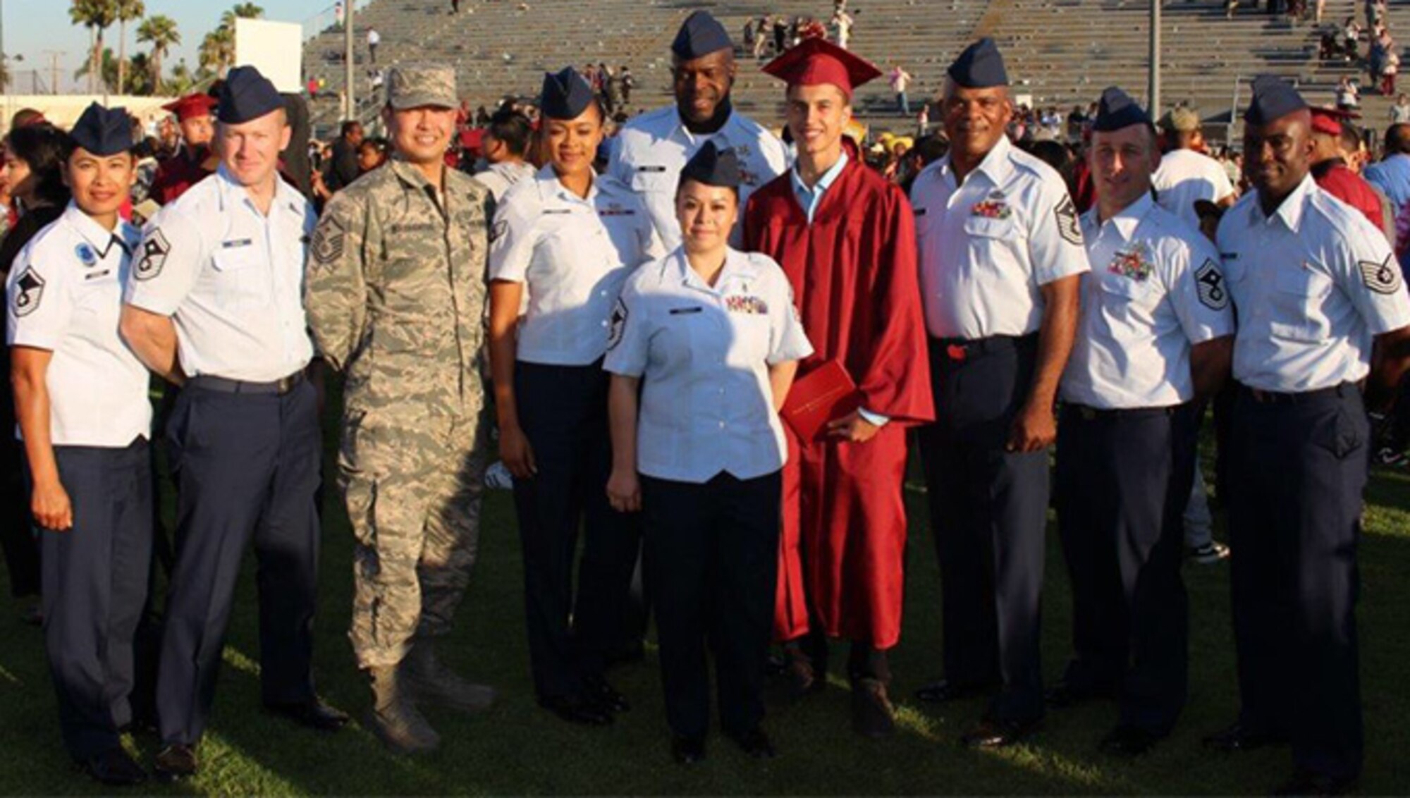 Team March members pose for a photo with Sean Kelly following his high school graduation ceremony in Long Beach, June 16, 2016. Sean is the son of Chief Master Sergeant Ericka Kelly, Command Chief Master Sergeant, Air Force Reserve Command, Robins Air Force Base, Georgia. 