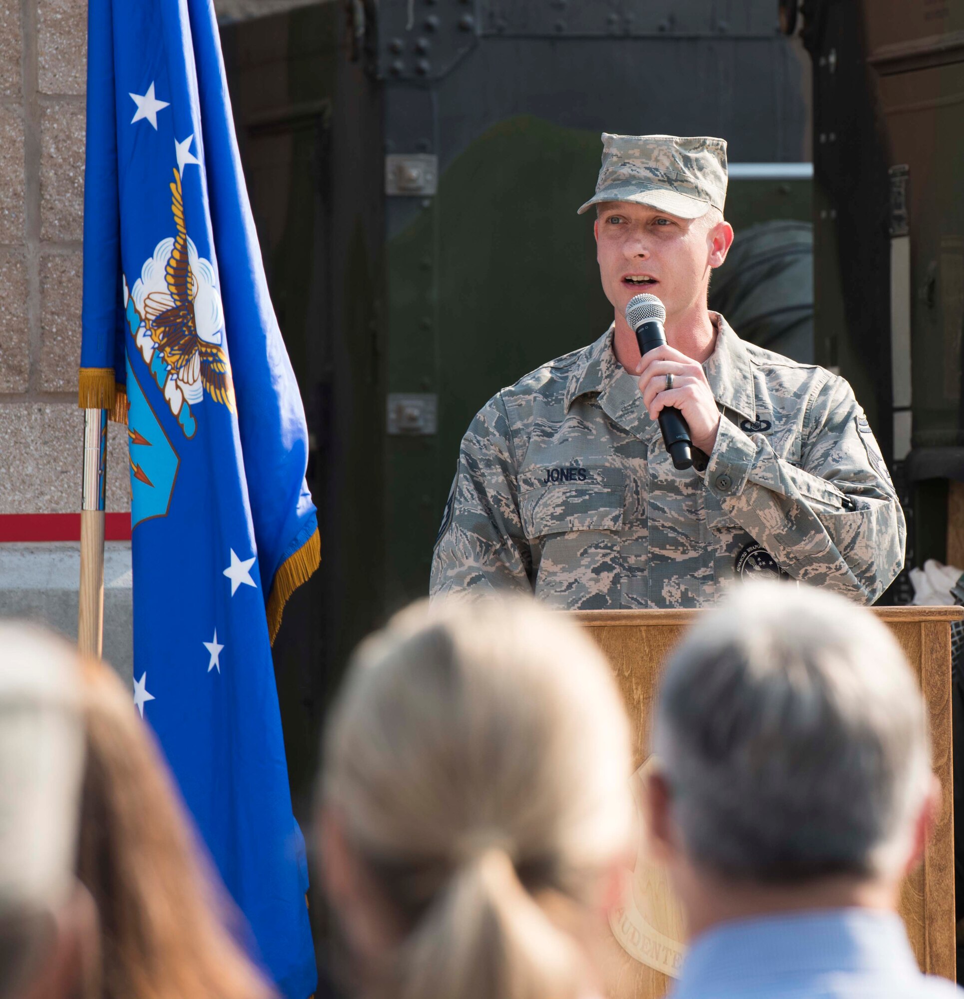 Senior Master Sgt. John Jones, 726th Air Control Squadron operations superintendent, narrates the ribbon cutting ceremony for their newly renovated compound August 18, 2016, at Mountain Home Air Force Base, Idaho. He began with thanking the people who came together to make the ceremony a reality. (U.S. Air Force photo by Airman Alaysia Berry/Released)