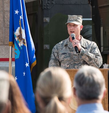 Senior Master Sgt. John Jones, 726th Air Control Squadron operations superintendent, narrates the ribbon cutting ceremony for their newly renovated compound August 18, 2016, at Mountain Home Air Force Base, Idaho. He began with thanking the people who came together to make the ceremony a reality. (U.S. Air Force photo by Airman Alaysia Berry/Released)