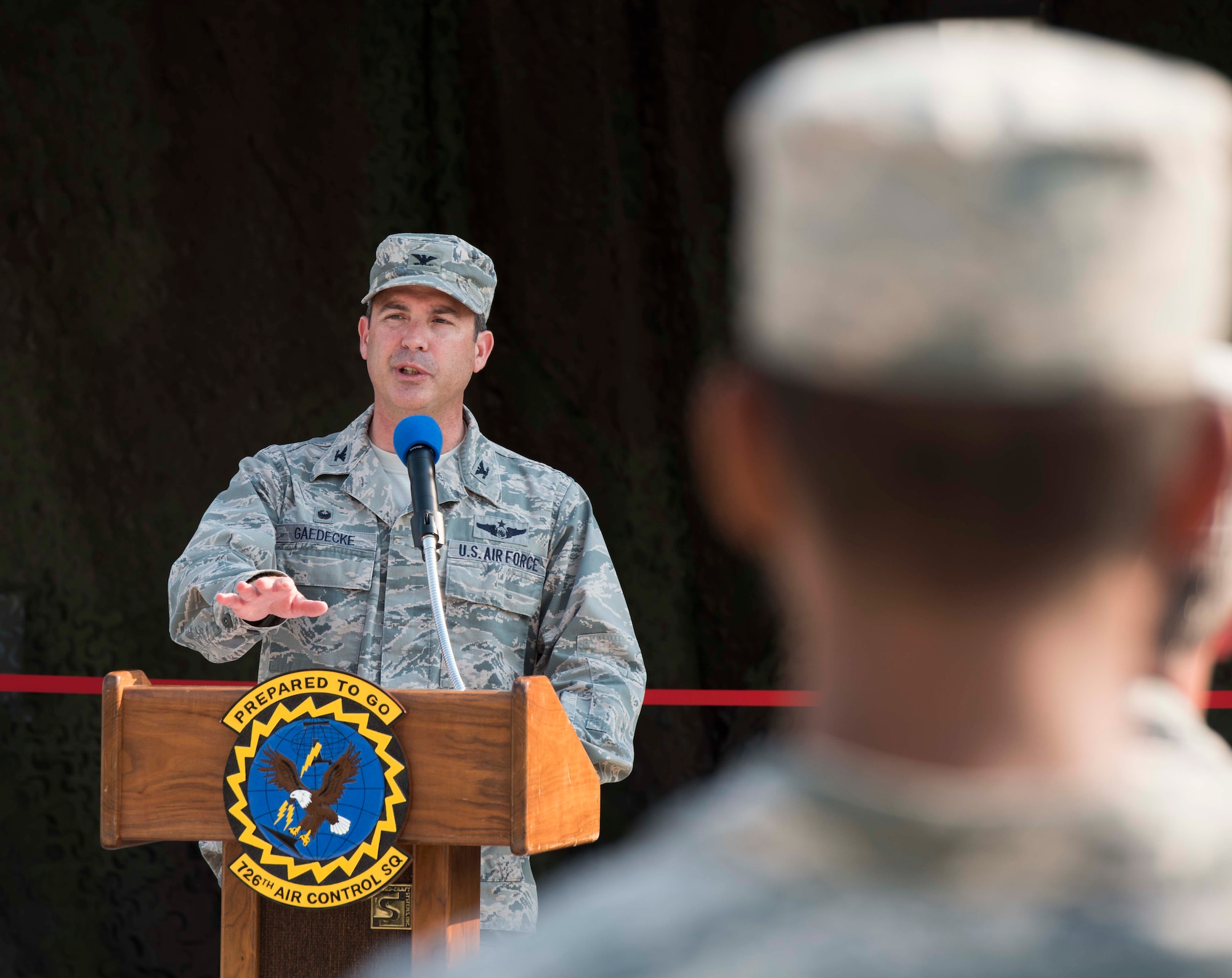Col. David Gaedecke, commander of the 552nd Air Control Wing, speaks to the audience at the ribbon cutting ceremony August 18, 2016, at Mountain Home Air Force Base, Idaho. The 726th Air Control Squadron works with the 366th Fighter Wing but is a part of the 552nd ACW at Tinker Air Force Base, Oklahoma. (U.S. Air Force photo by Airman Alaysia Berry/Released)
