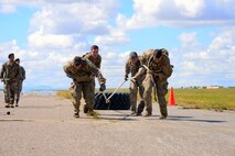 Airmen assigned to the 741st Missile Security Forces Squadron Tactical Response Force team, pull a tire during the 5th Annual Ace’s Cop Combat Challenge Aug. 19, 2016, at Malmstrom Air Force Base, Mont. Defenders from across the 341st Security Forces Group competed in AC3 by completing multiple feats in order to place in various categories. (U.S. Air Force photo/Airman 1st Class Magen M. Reeves)