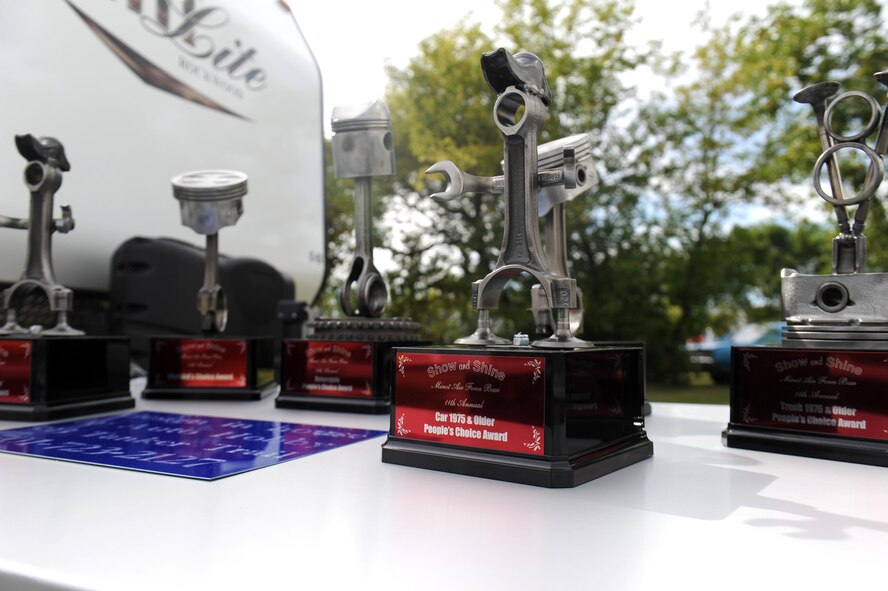 Show and Shine Car Show trophies are displayed at the Rough Rider Golf Course at Minot Air Force Base, N.D.,  Aug. 19, 2016. The trophies were given to winners of the car show at the annual end of summer block party. (U.S. Air Force photo by Staff Sgt. Chad Trujillo)