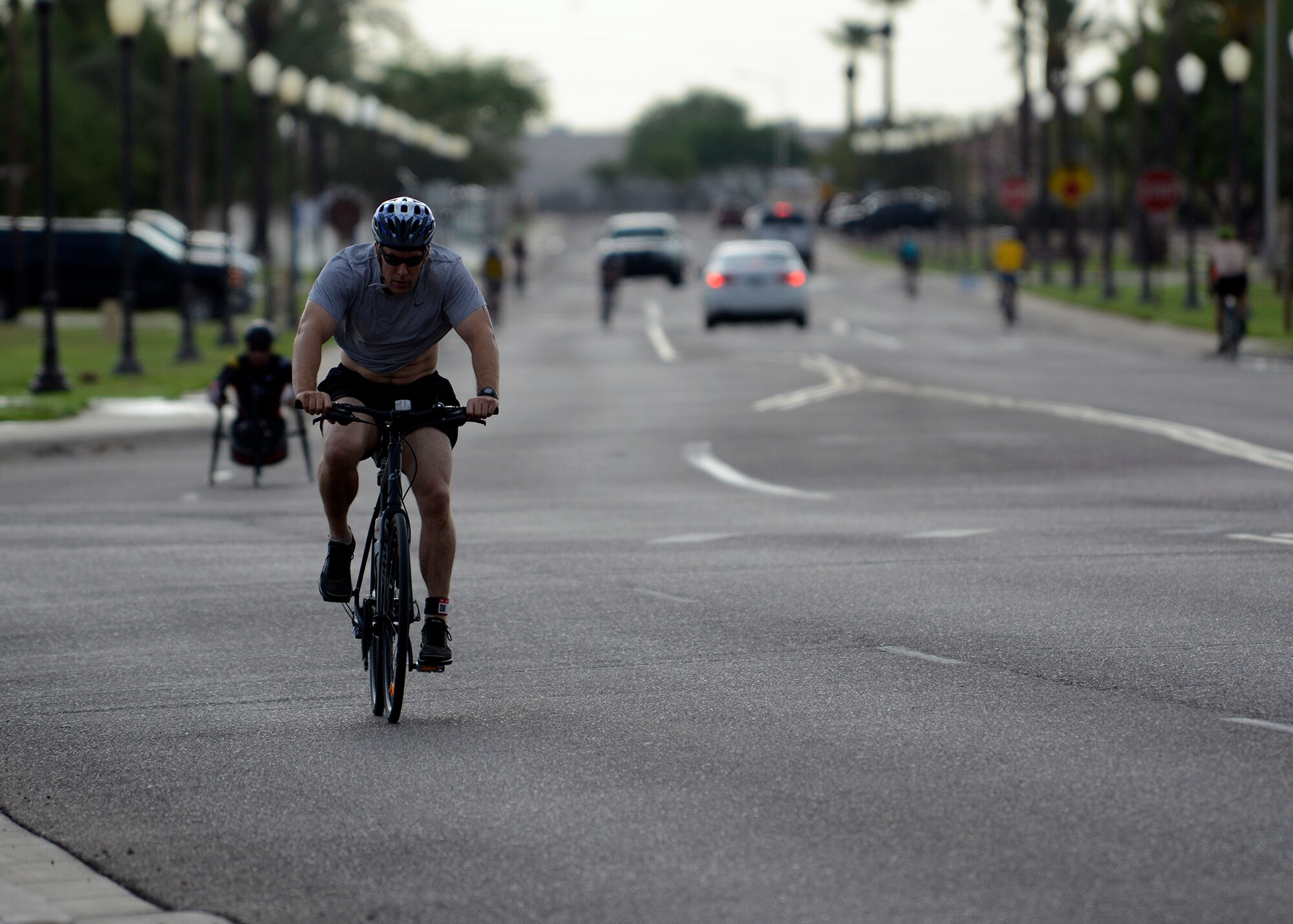 Brig. Gen. Brook Leonard, 56th Fighter Wing commander, partakes in the 12-mile bike portion of the triathlon Aug. 20, 2016 at Luke Air Force Base, Ariz. The triathlon consisted of swimming 400 meters, biking 11.4 miles, and running five kilometers in both individual and team competitions. (U.S. Air Force photo by Senior Airman Devante Williams)