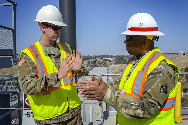 U.S. Army Corps of EngineersCommand Sgt. Maj. Antonio S. Jones talks with 1LT William Mengon about the Folsom Dam auxiliary spillway during a visit on Aug. 17, 2016. Jones visited Sacramento District projects at Folsom as well as Englebright and Black Butte Lakes during his two-day visit. 